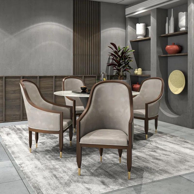 Everly Quinn Jacinto Dining Chair Upholstered In Leather With Rubberwood Frame And Legs With Gold Caps