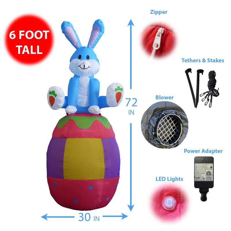 The Holiday Aisle® 6 Foot Tall Happy Easter Lighted Inflatable Bunny Rabbit Sitting on Easter Egg Indoor / Outdoor Blow Up Yard Decoration Inflatable