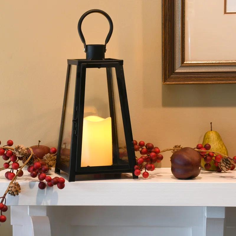 The Holiday Aisle® Black Tapered Metal Lantern with Battery Operated Candle