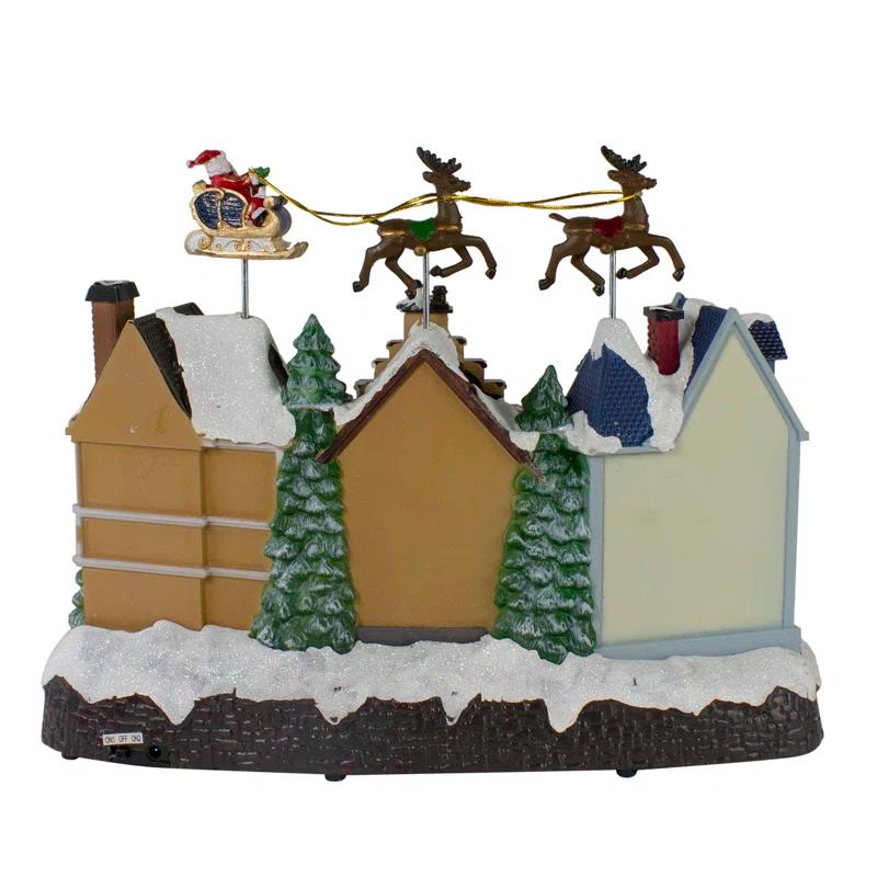 Northlight Seasonal 16" White and Brown LED Lighted and Animated Christmas Village with Flying Sleigh Tabletop Decor