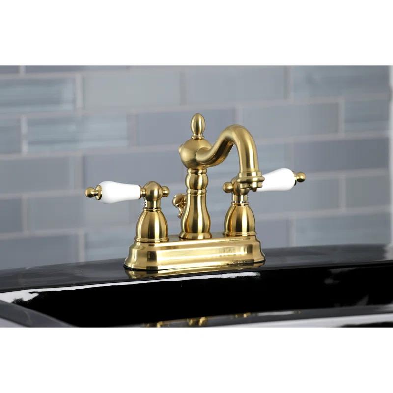 Kingston Brass Heritage Two-Handle 3-Hole Deck Mount 4" Centerset Bathroom Faucet with Plastic Pop-Up