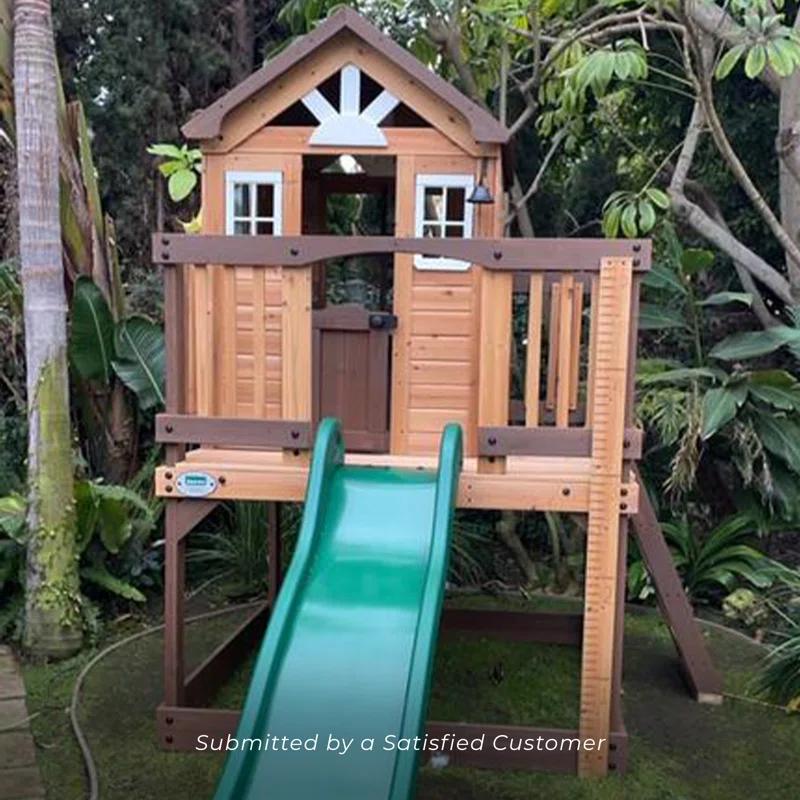 Backyard Discovery Echo Heights Cedar Wooden Elevated Kids Playhouse with Wave Slide, Play Kitchen, and Deck & Reviews | Wayfair