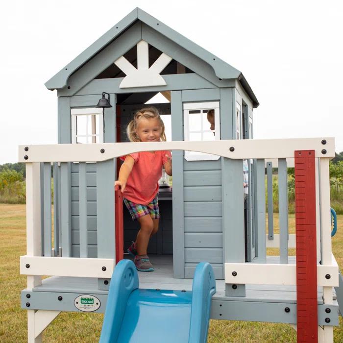 Backyard Discovery Backyard Discovery Beacon Heights Cedar Wooden Elevated Kids Playhouse with Wave Slide, Play Kitchen, and Deck