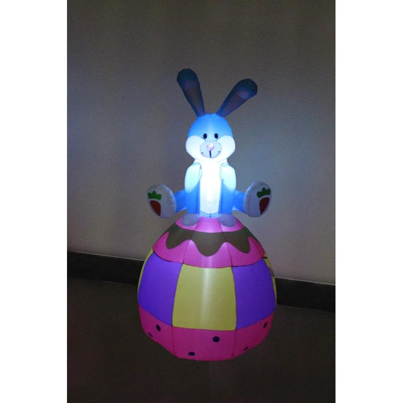 The Holiday Aisle® 6 Foot Tall Happy Easter Lighted Inflatable Bunny Rabbit Sitting on Easter Egg Indoor / Outdoor Blow Up Yard Decoration Inflatable