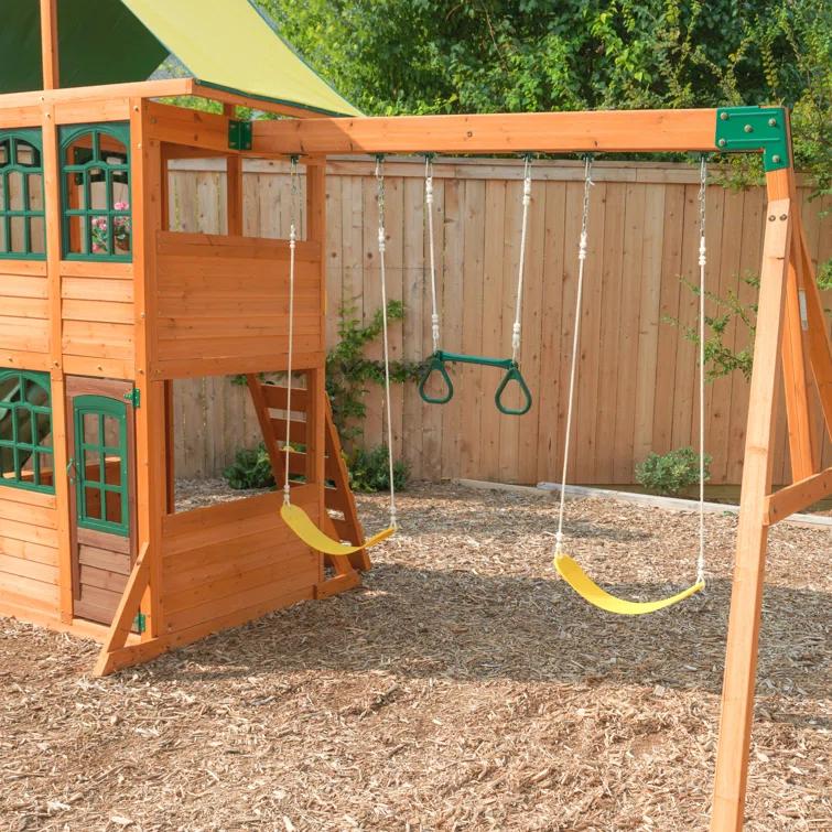 KidKraft Treasure Cove Wooden Swing Set with Slides and Rock Wall