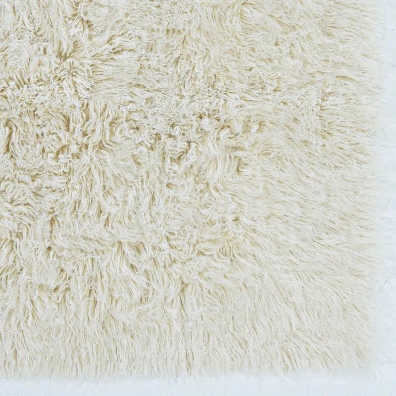 Ebern Designs Aaiden Flokati Wool Shag Hand Loomed Ivory Rug