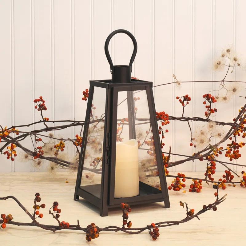 The Holiday Aisle® Black Tapered Metal Lantern with Battery Operated Candle
