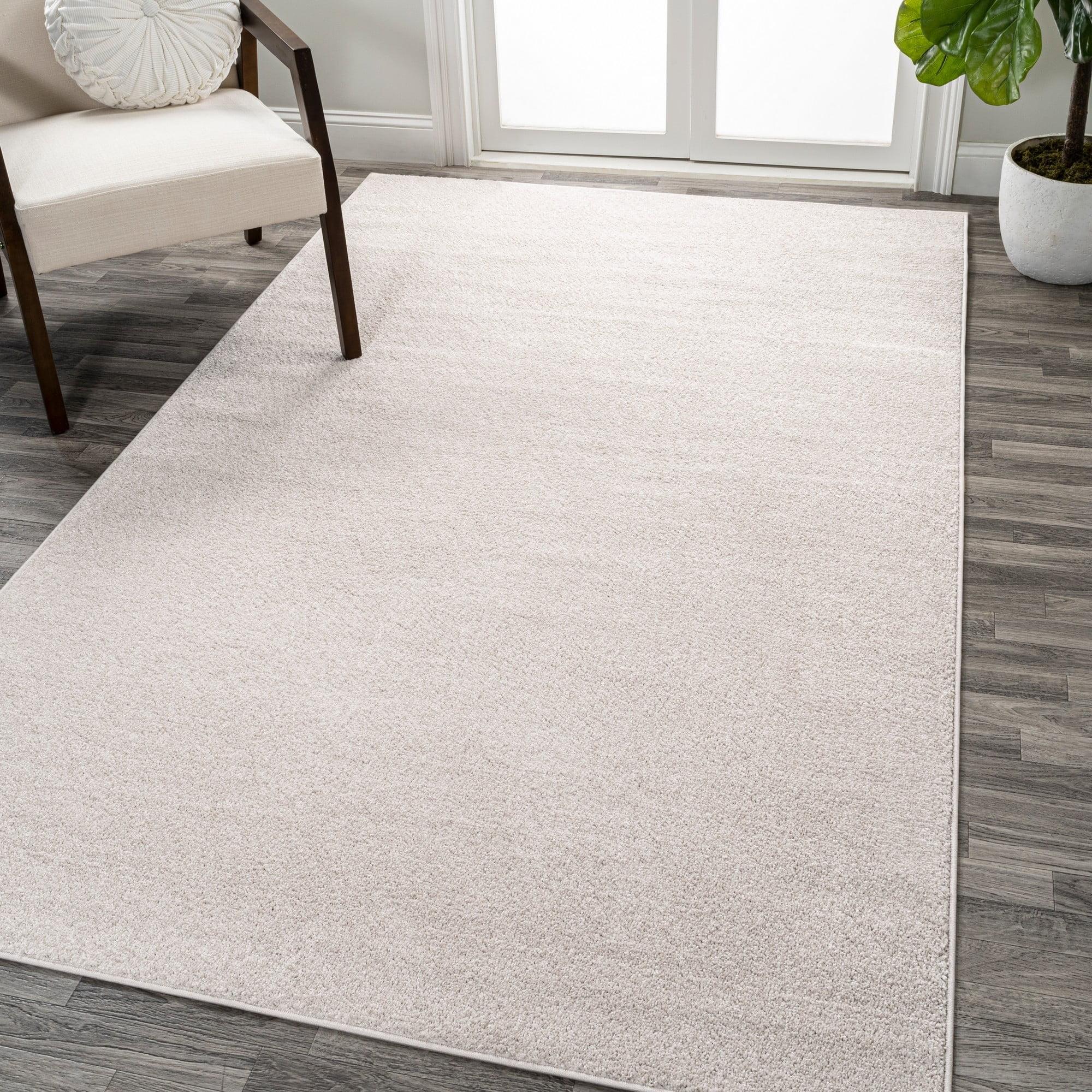 Ivory Solid Synthetic 10' x 14' Reversible Area Rug