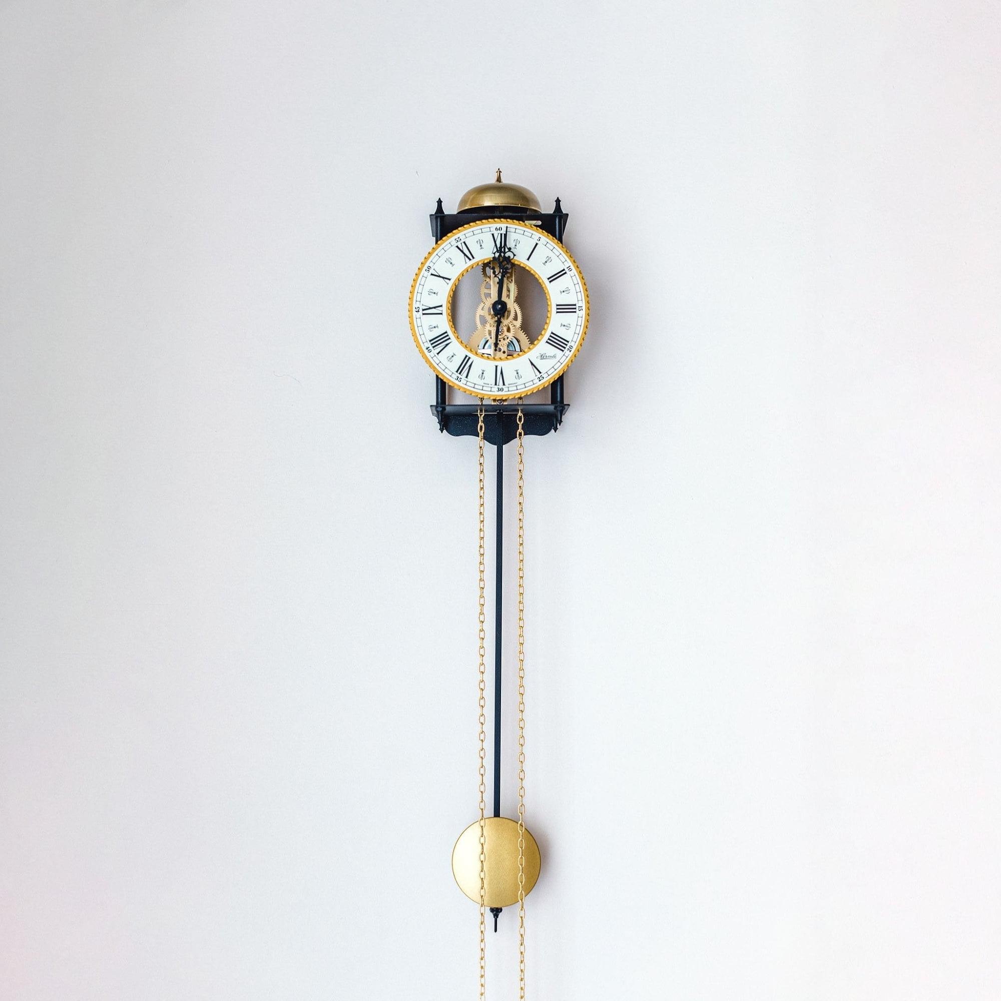 Hermle 25" Black and Gold Round Skeleton Pendulum Wall Clock