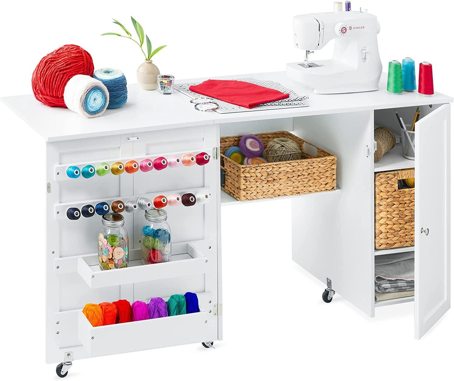 Compact White Folding Sewing and Craft Table with Storage and Caster Wheels