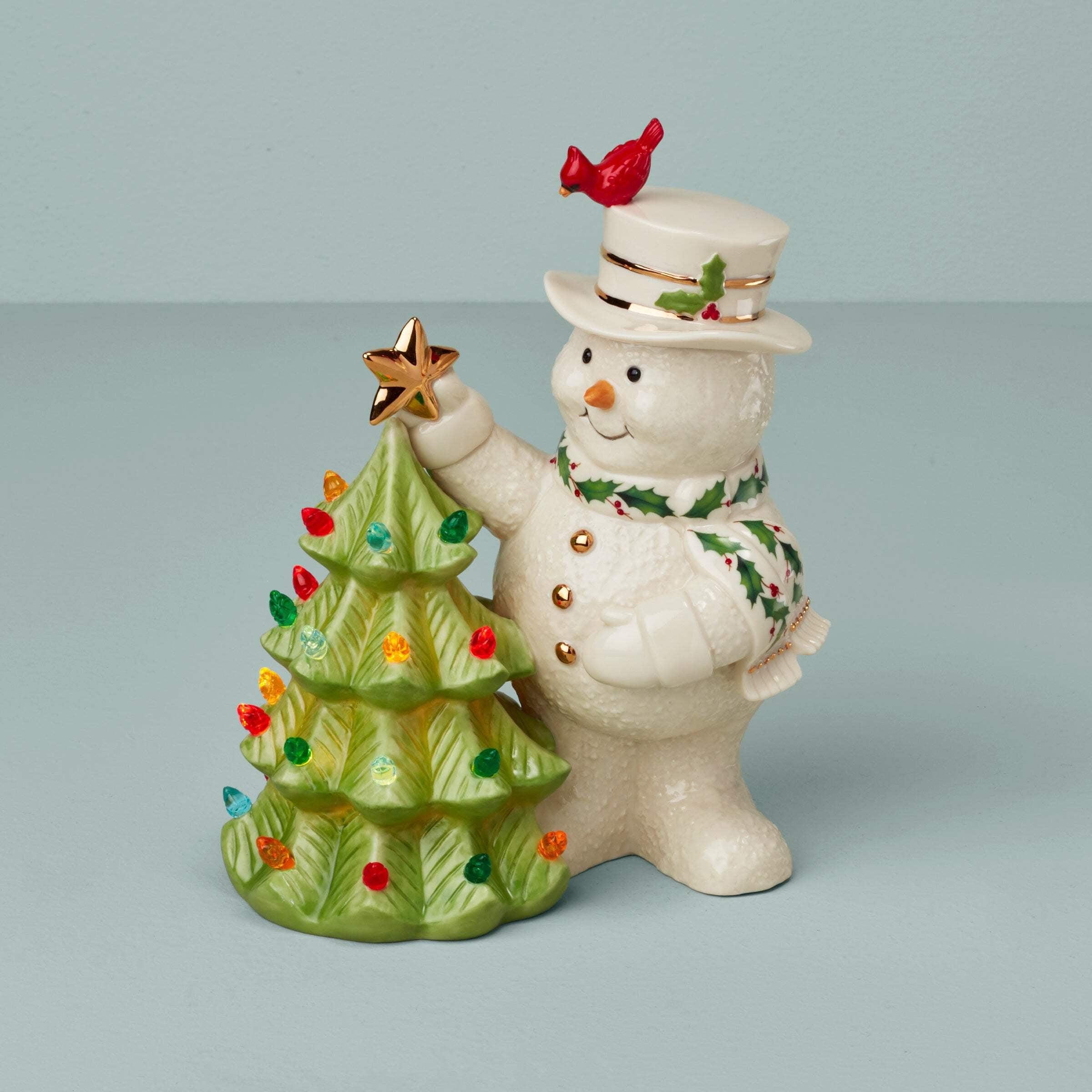 Porcelain Snowman Figurine with Gold Detailing and Christmas Tree