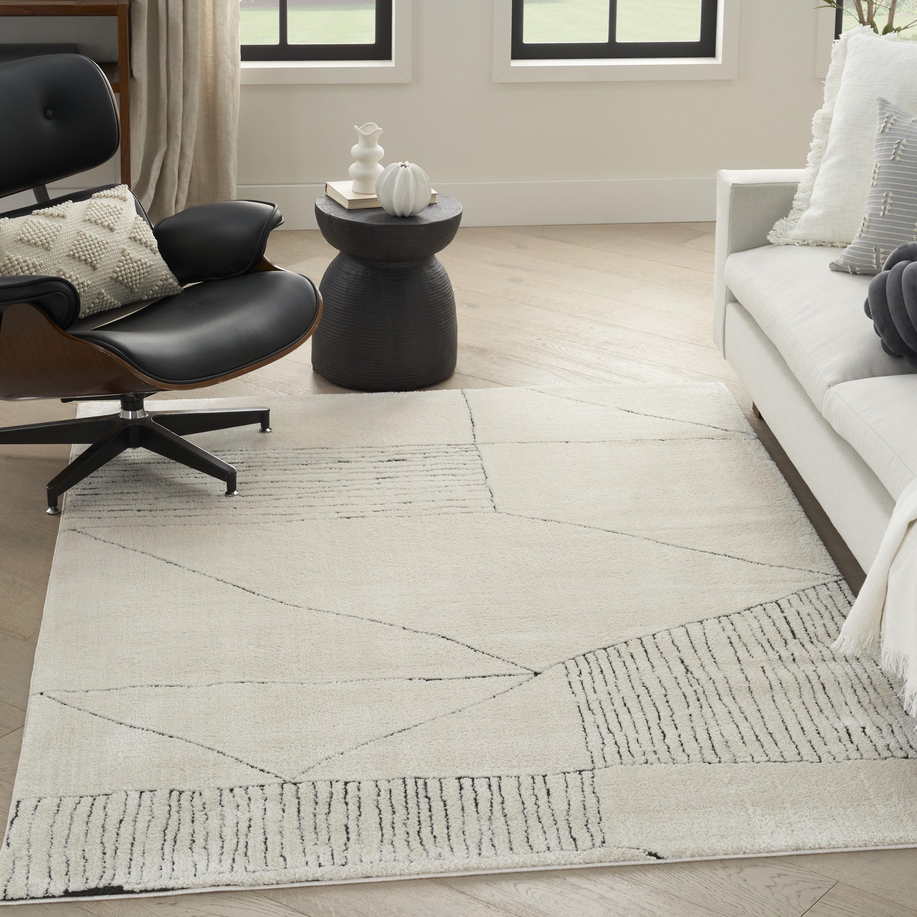 Black and Ivory Abstract Synthetic 8' x 10' Area Rug