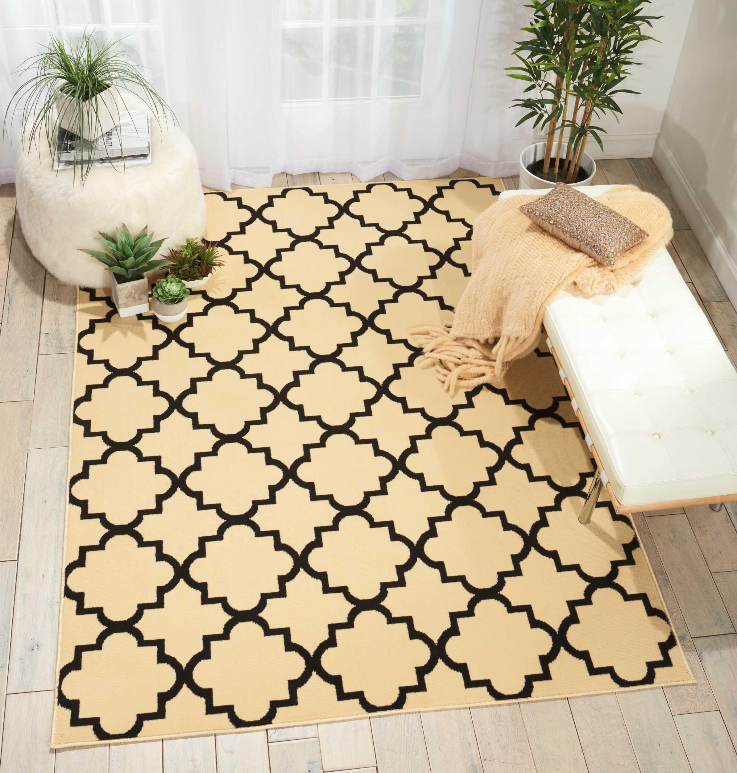 Cream and Black Geometric Pattern 5' x 7' Synthetic Area Rug