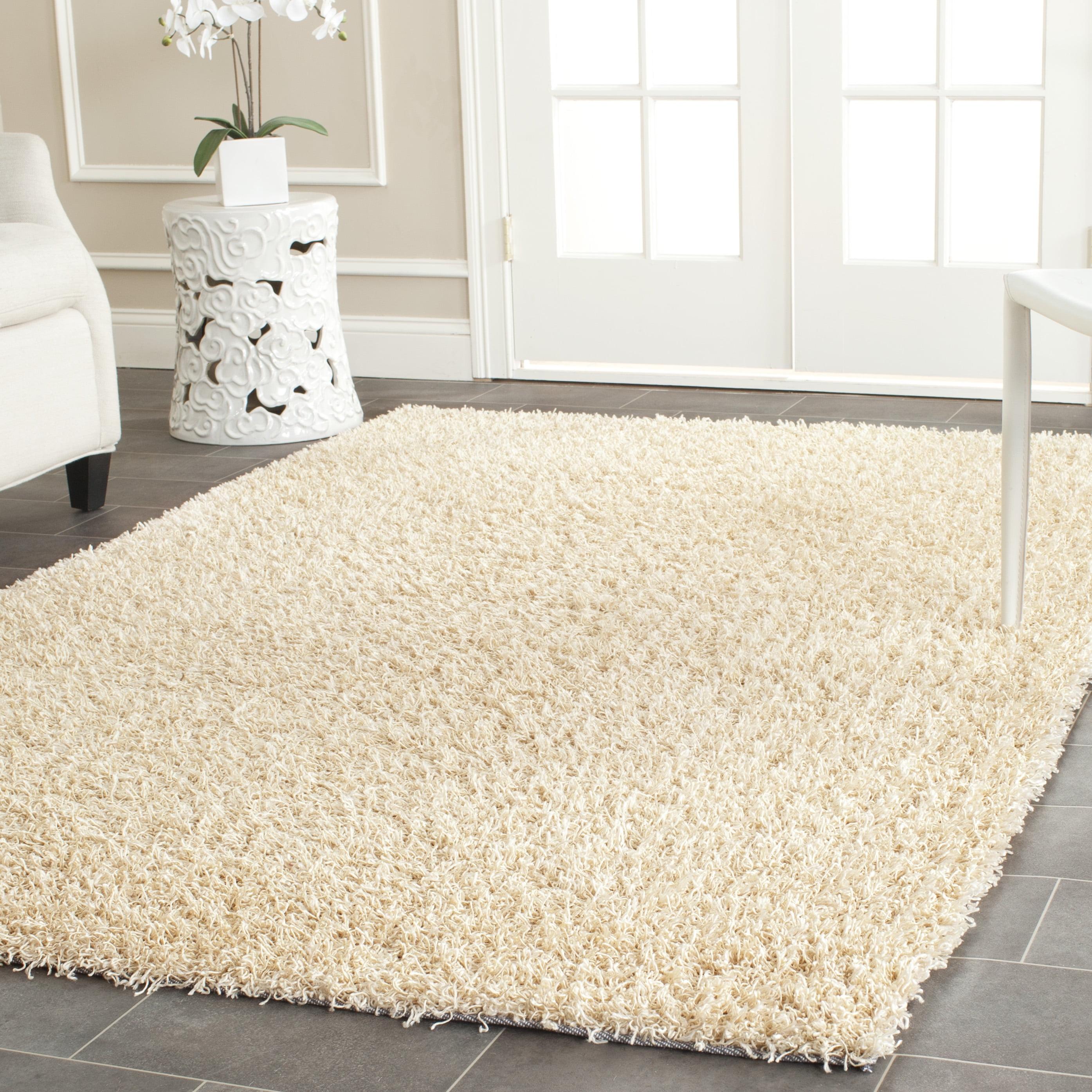 SAFAVIEH Clyde Solid Plush Polyester Shag Area Rug, Cream, 6' x 9'