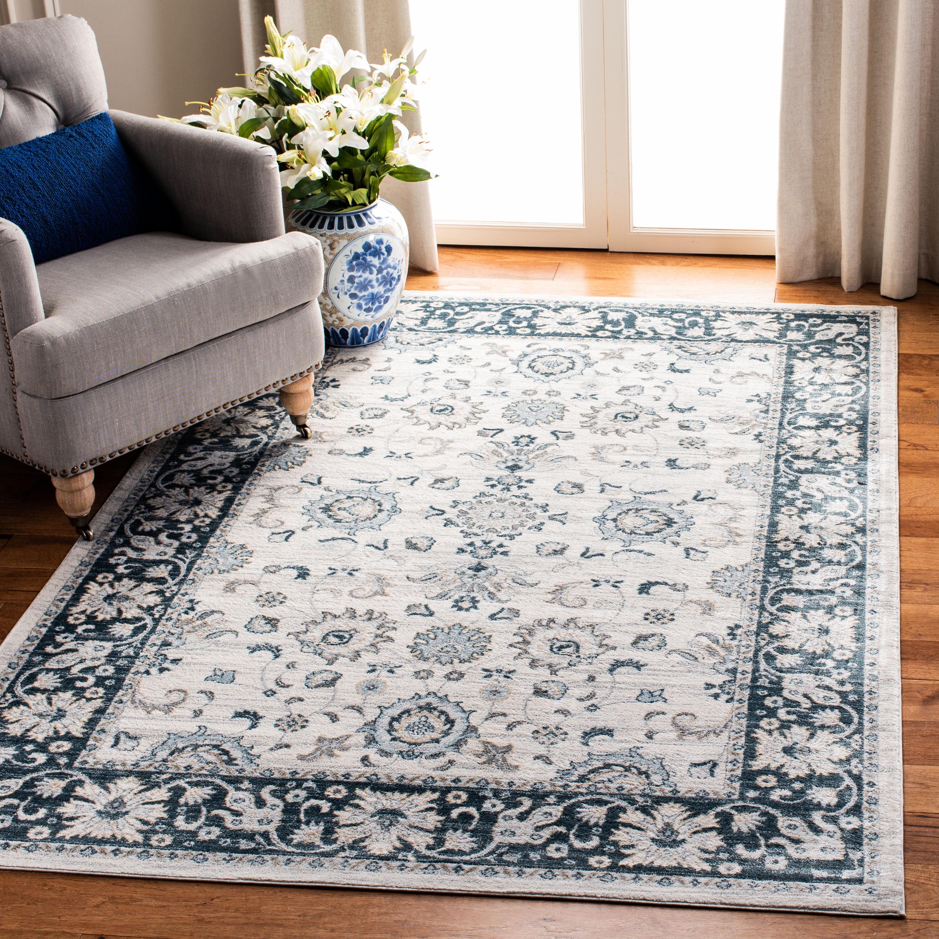 Isabella Cream and Navy 4' x 6' Synthetic Oriental Area Rug