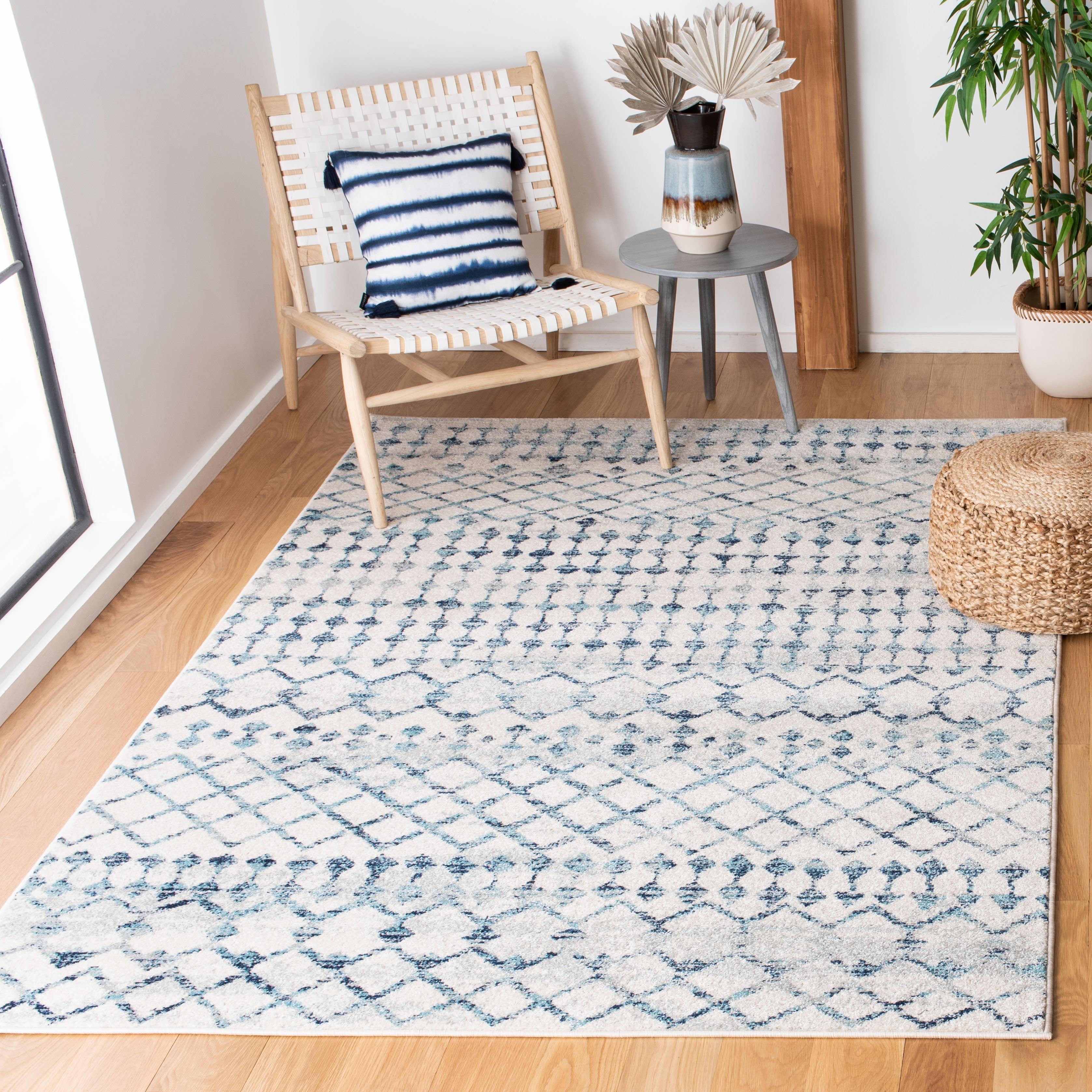 Ivory and Turquoise Geometric Synthetic Area Rug