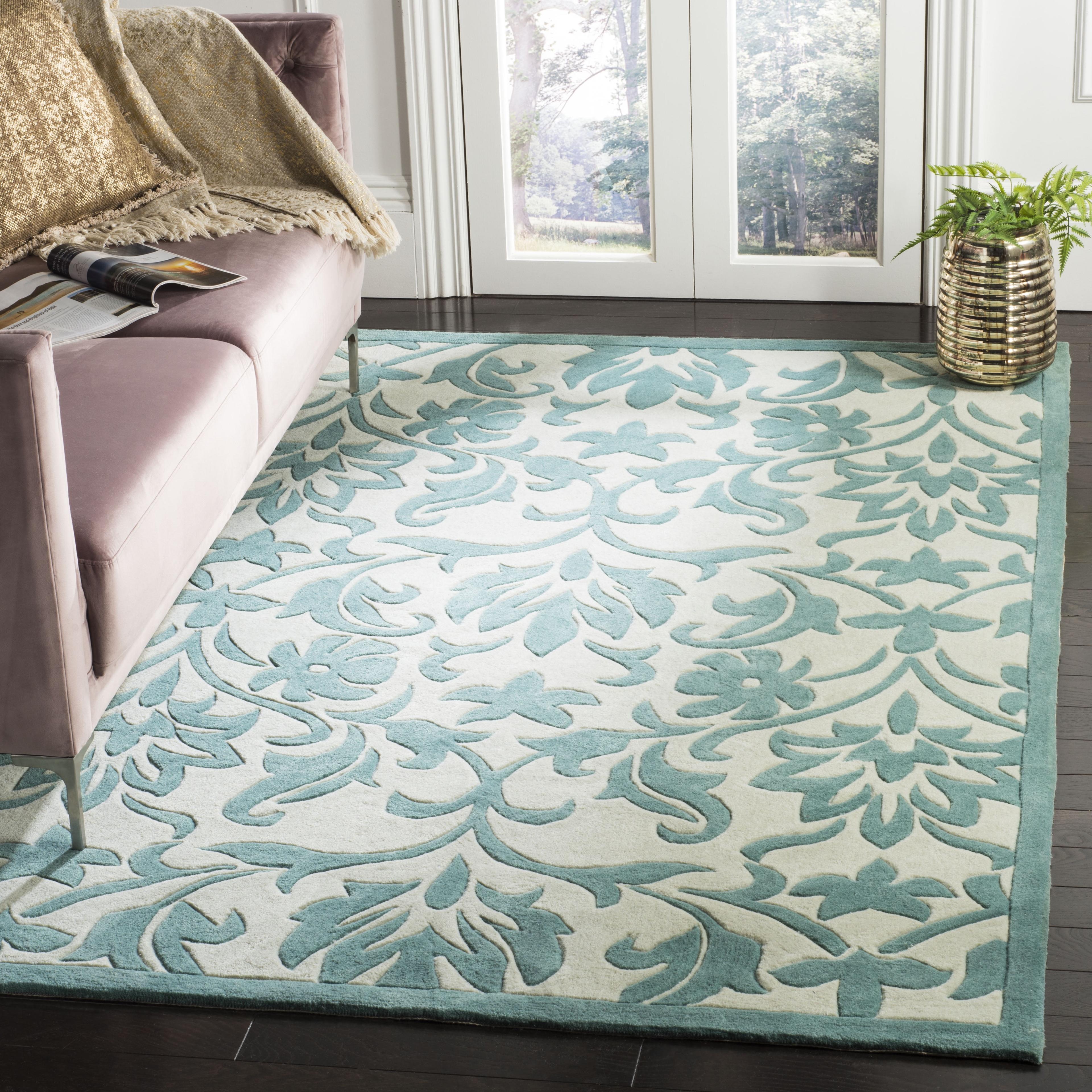 Ivory and Light Blue Hand-Tufted Synthetic 4' x 6' Area Rug