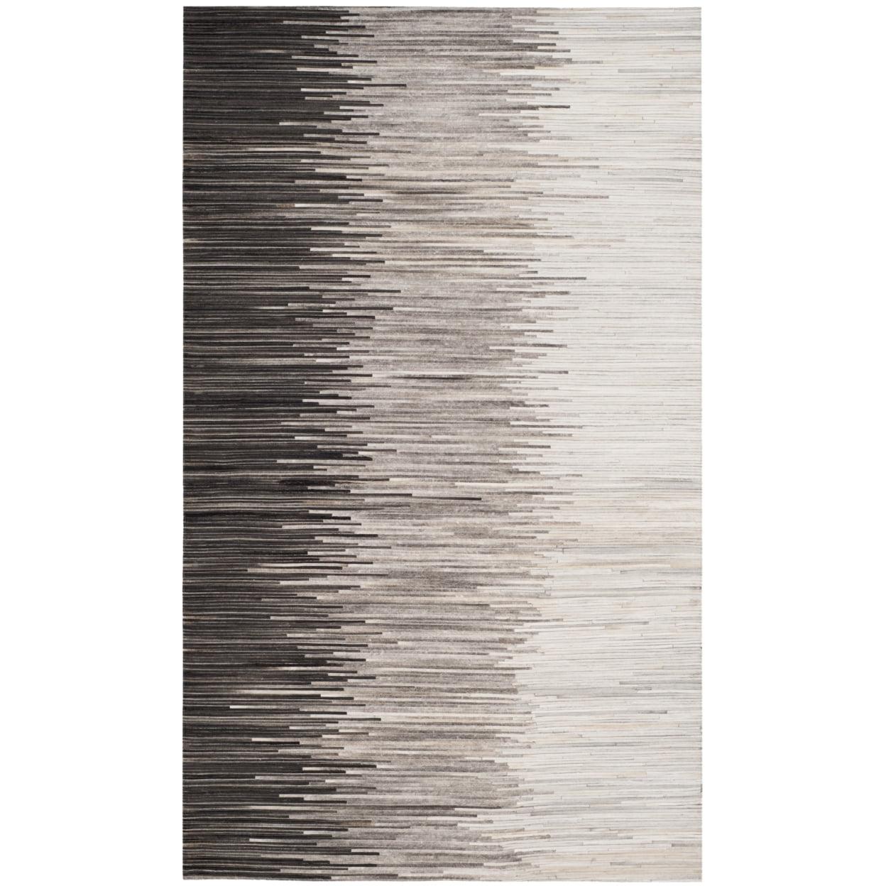 Handmade Ivory and Charcoal Geometric Cowhide Area Rug