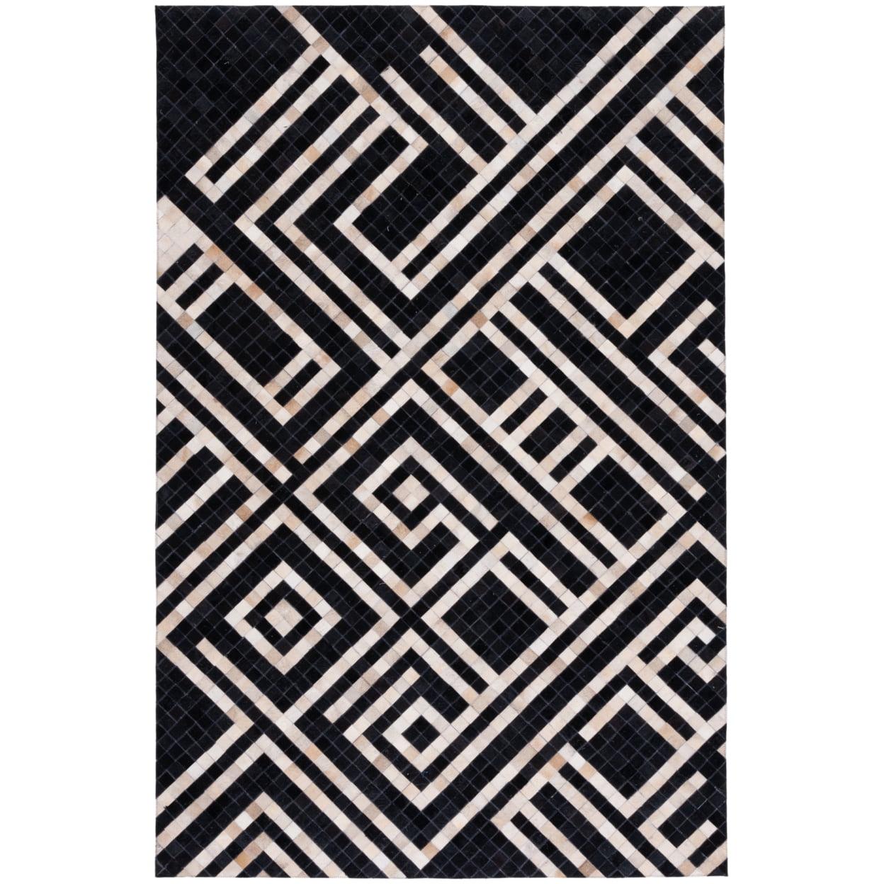 Handmade Black and Ivory Geometric Cowhide Area Rug