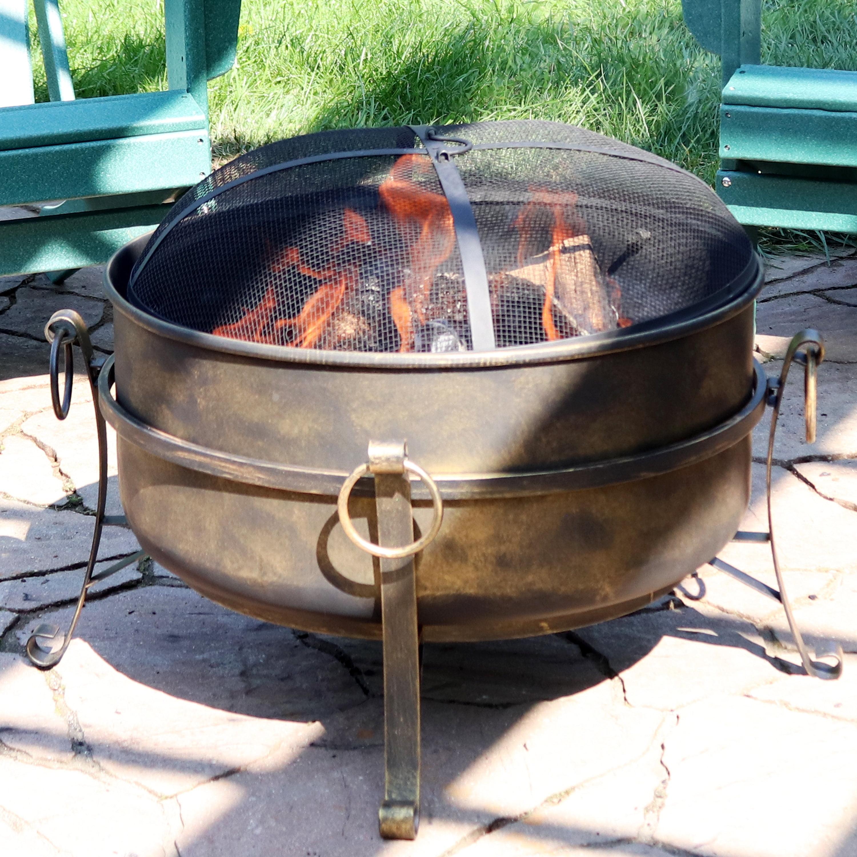 Sunnydaze Outdoor Camping or Backyard Round Cauldron Fire Pit with Spark Screen, Log Poker, and Metal Wood Grate - 24"