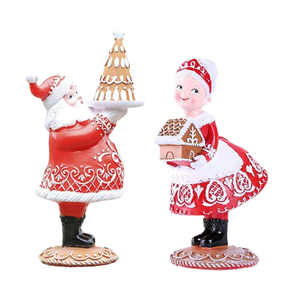 Red and Brown Resin Santa and Mrs. Claus Figurines