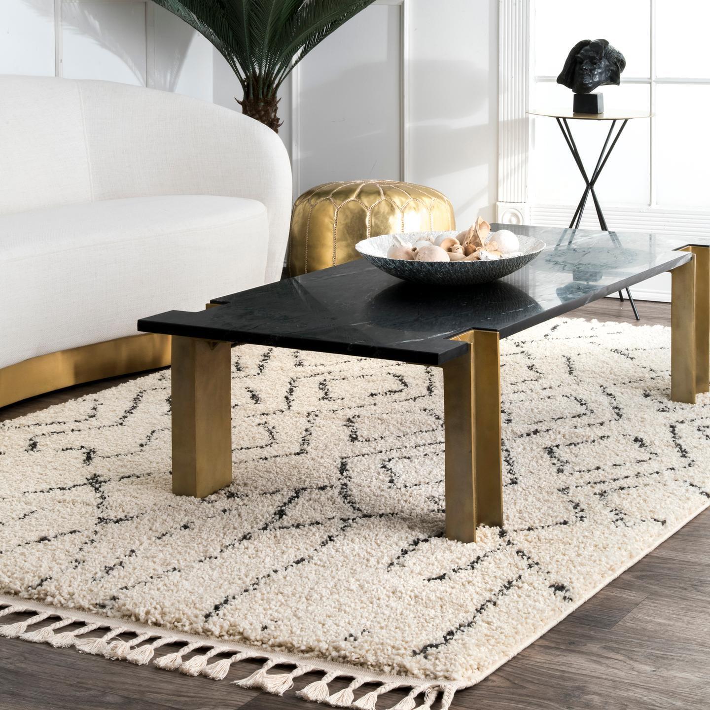 Ivory Geometric Synthetic Rectangular Area Rug with Tassels