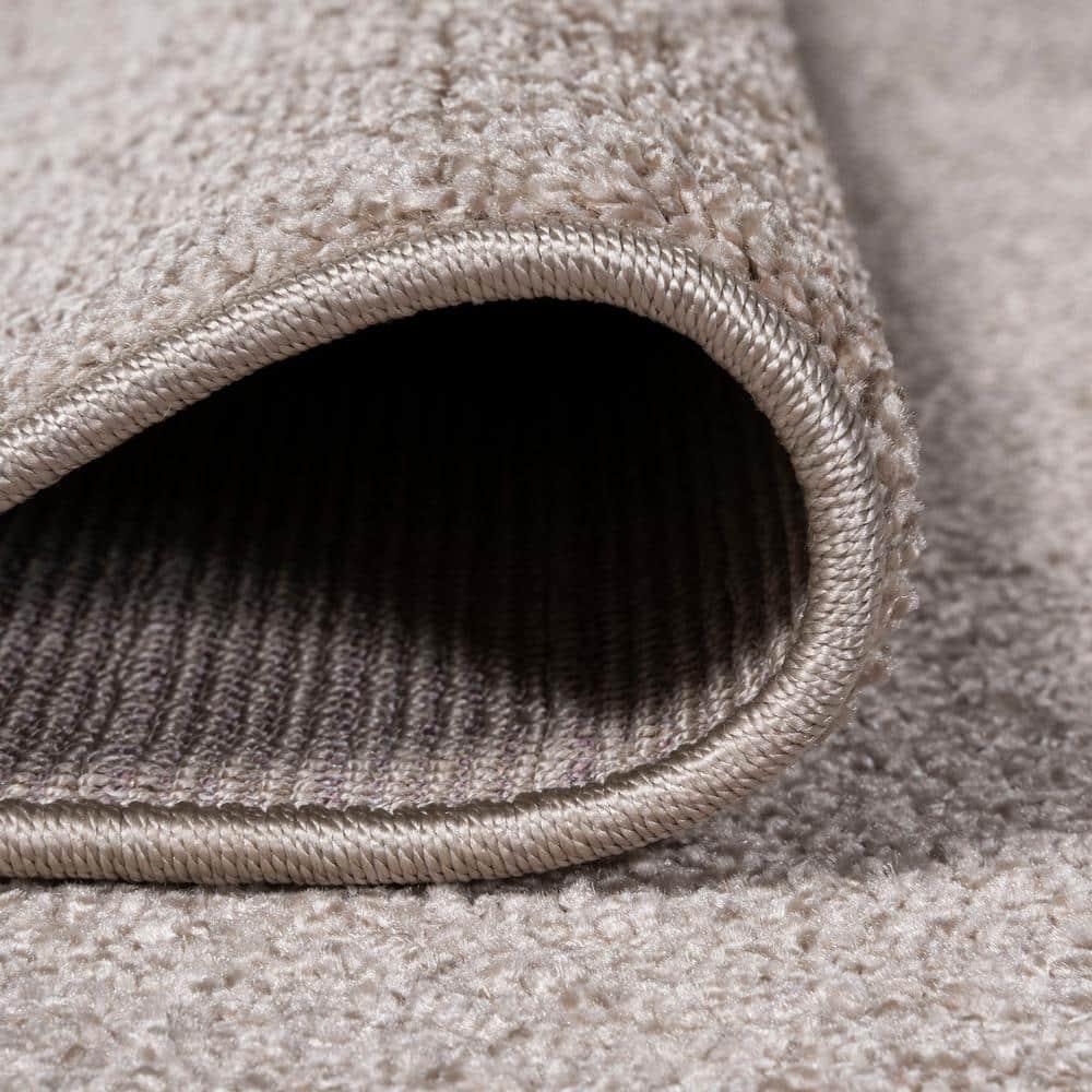 8'x10' Haze Solid Low-Pile Area Rug, Beige - JONATHAN Y