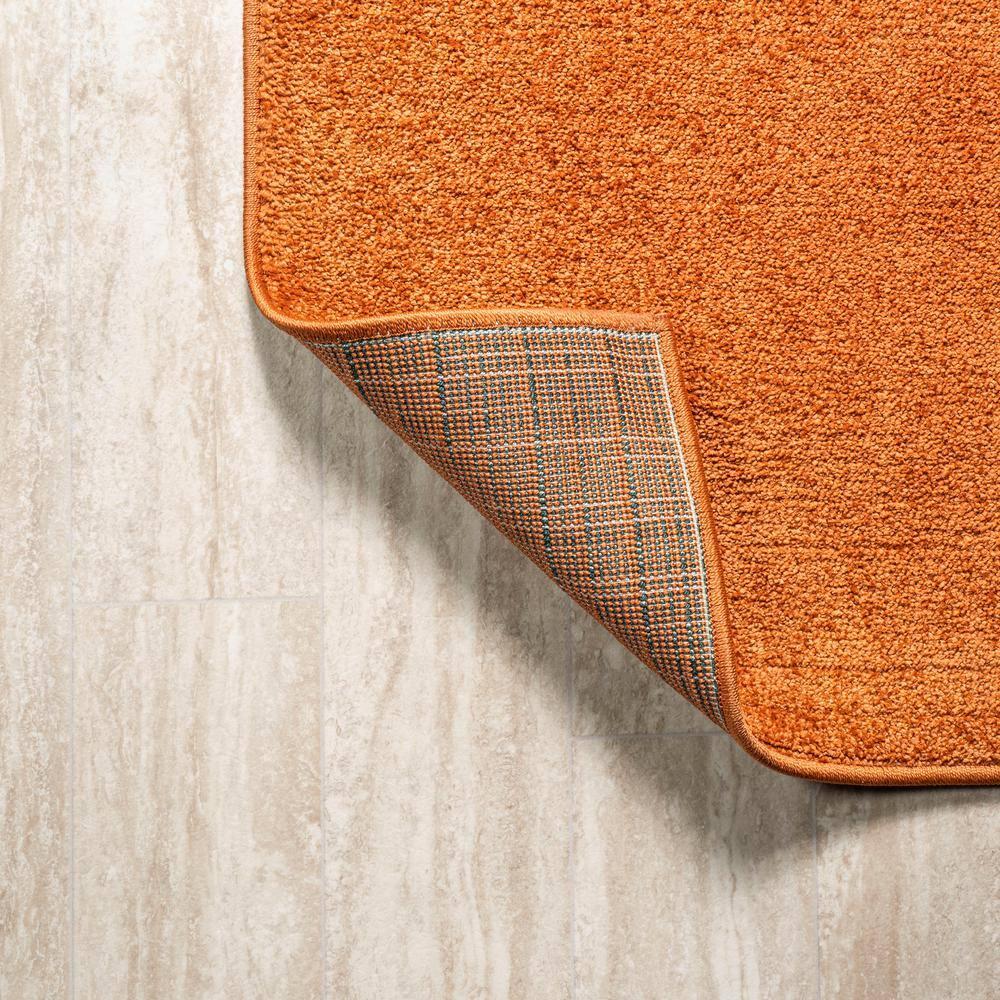 Haze Solid Low-Pile Orange 10 ft. x 14 ft. Area rug -JONATHAN Y