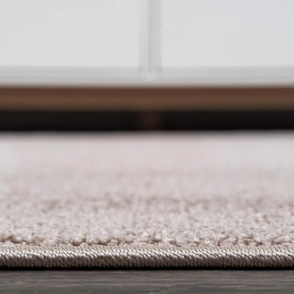 8'x10' Haze Solid Low-Pile Area Rug, Beige - JONATHAN Y