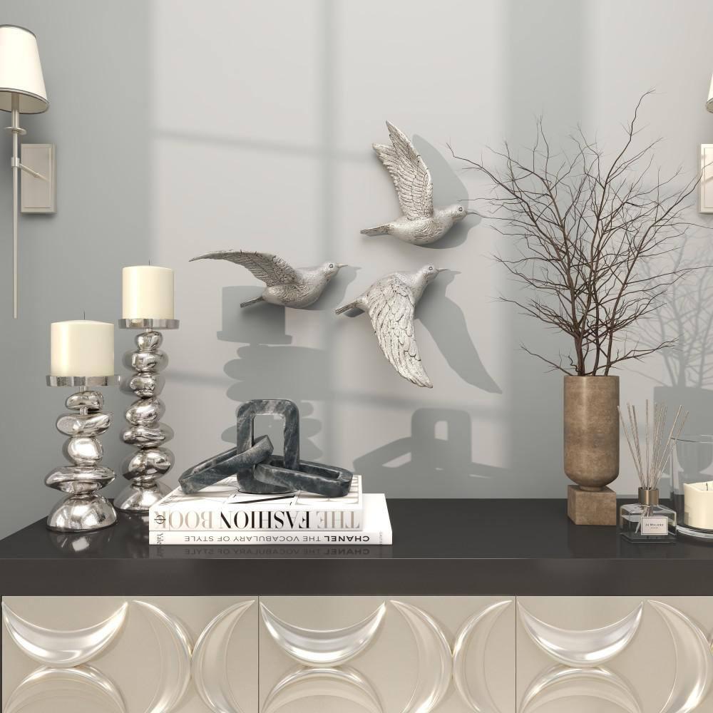 DecMode Silver Polystone Metallic 3D Sculpted Bird Wall Decor (3 Count)