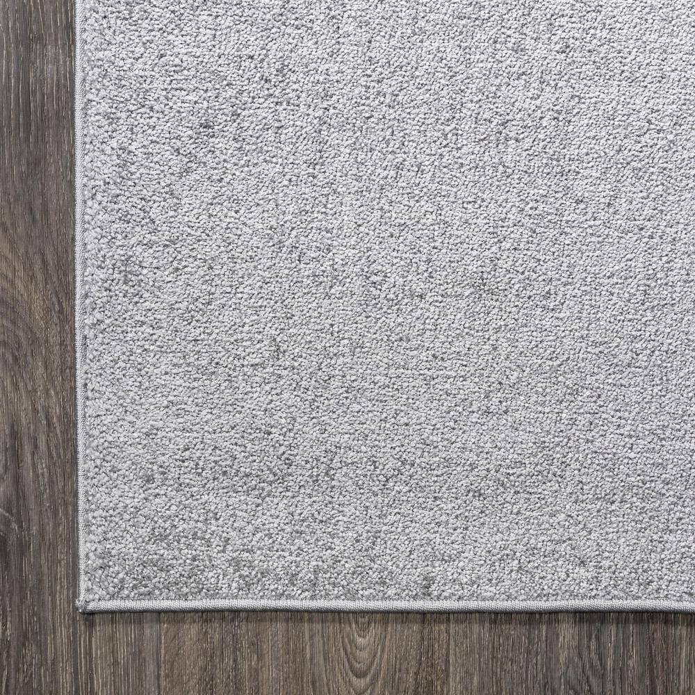 8'x10' Haze Solid Low-Pile Area Rug, Light Gray - JONATHAN Y