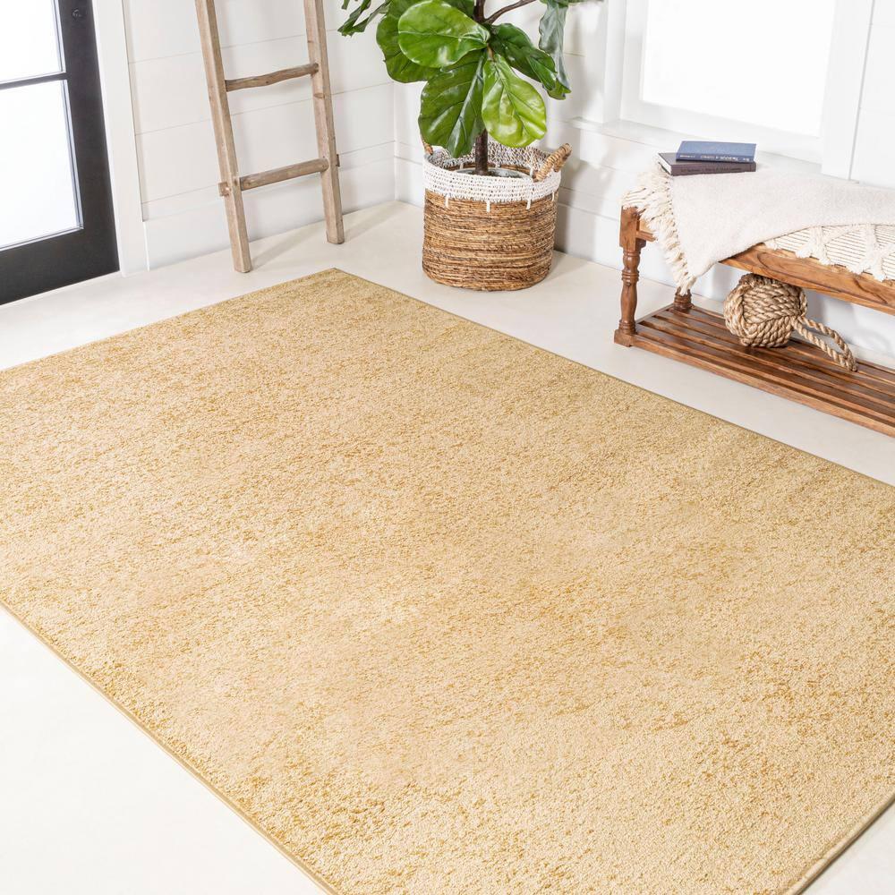 8'x10' Haze Solid Low-Pile Area Rug, Mustard - JONATHAN Y