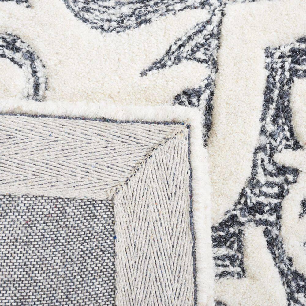 Metro MET859 Hand Tufted Indoor Area Rug - Black/Ivory - 8'x10' - Safavieh