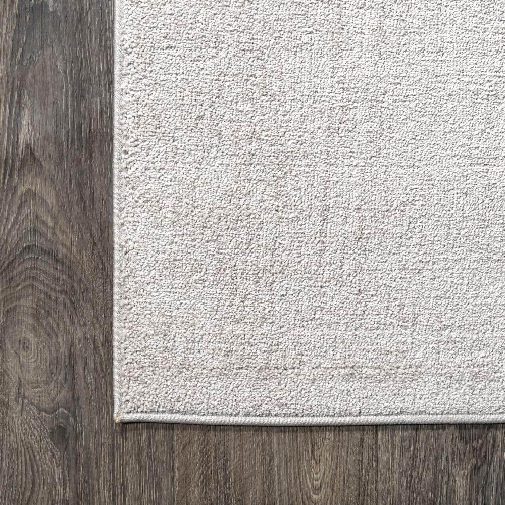 8'x10' Haze Solid Low-Pile Area Rug, Ivory - JONATHAN Y
