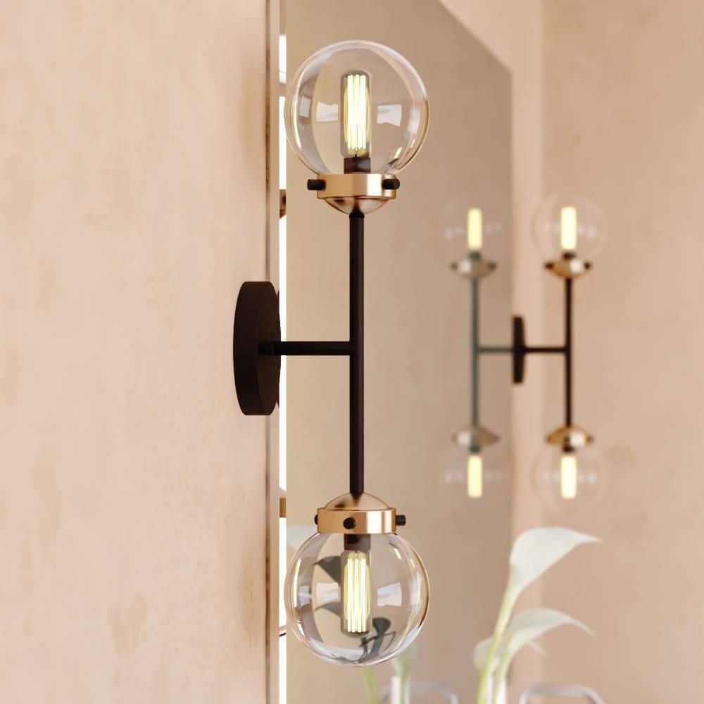 Vaxcel Orbit 2 Light Brass and Oil Rubbed Bronze Industrial MCM Wall Sconce Clear Glass Globe