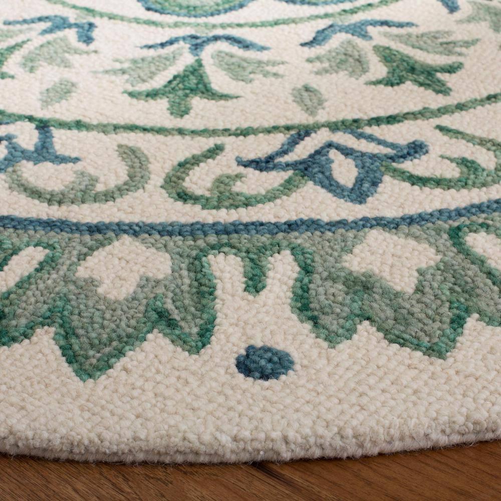 Novelty NOV607 Hand Tufted Area Rug - Ivory/Teal - 6' Round - Safavieh.