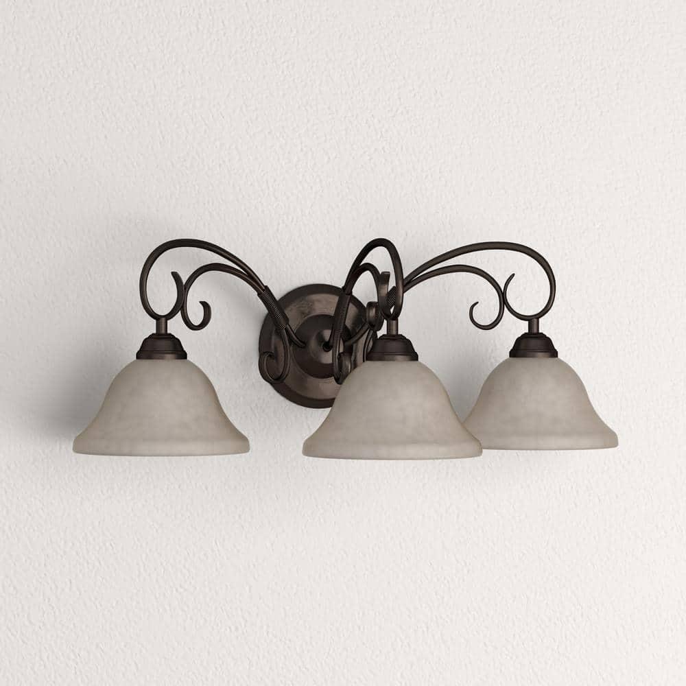 Golden Lighting Homestead 3-Light Vanity Light in Rubbed Bronze with Tea Stone Glass