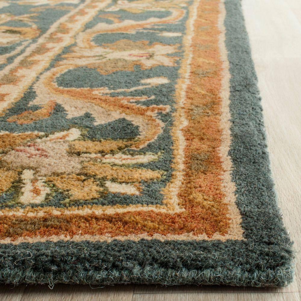SAFAVIEH Antiquity Carmella Floral Bordered Wool Area Rug, Blue/Gold, 9' x 12'