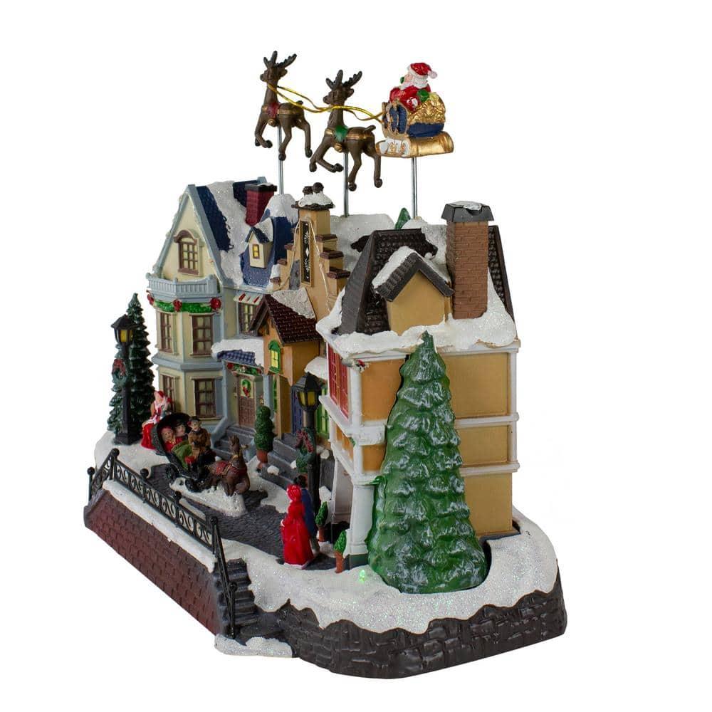 Northlight Seasonal 16" White and Brown LED Lighted and Animated Christmas Village with Flying Sleigh Tabletop Decor