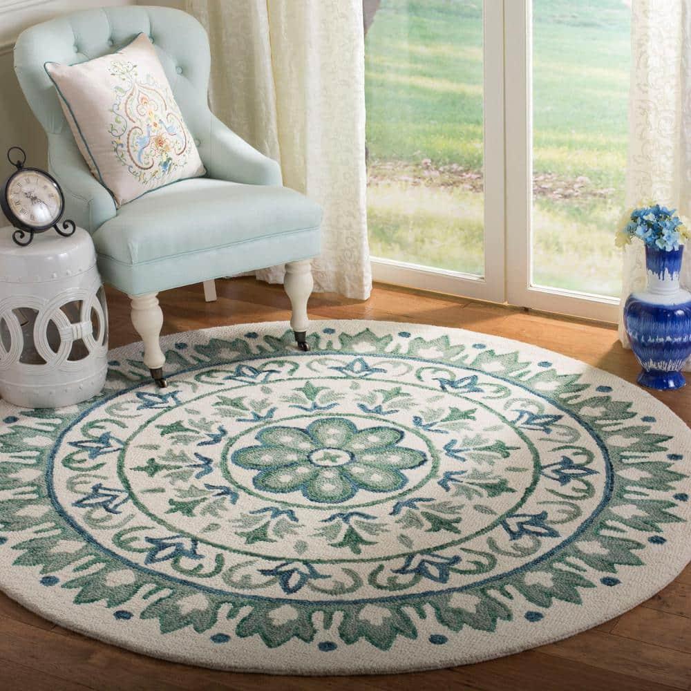 Novelty NOV607 Hand Tufted Area Rug - Ivory/Teal - 5' round - Safavieh.
