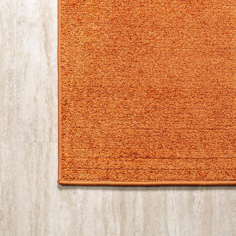 8'x10' Haze Solid Low-Pile Area Rug, Orange - JONATHAN Y