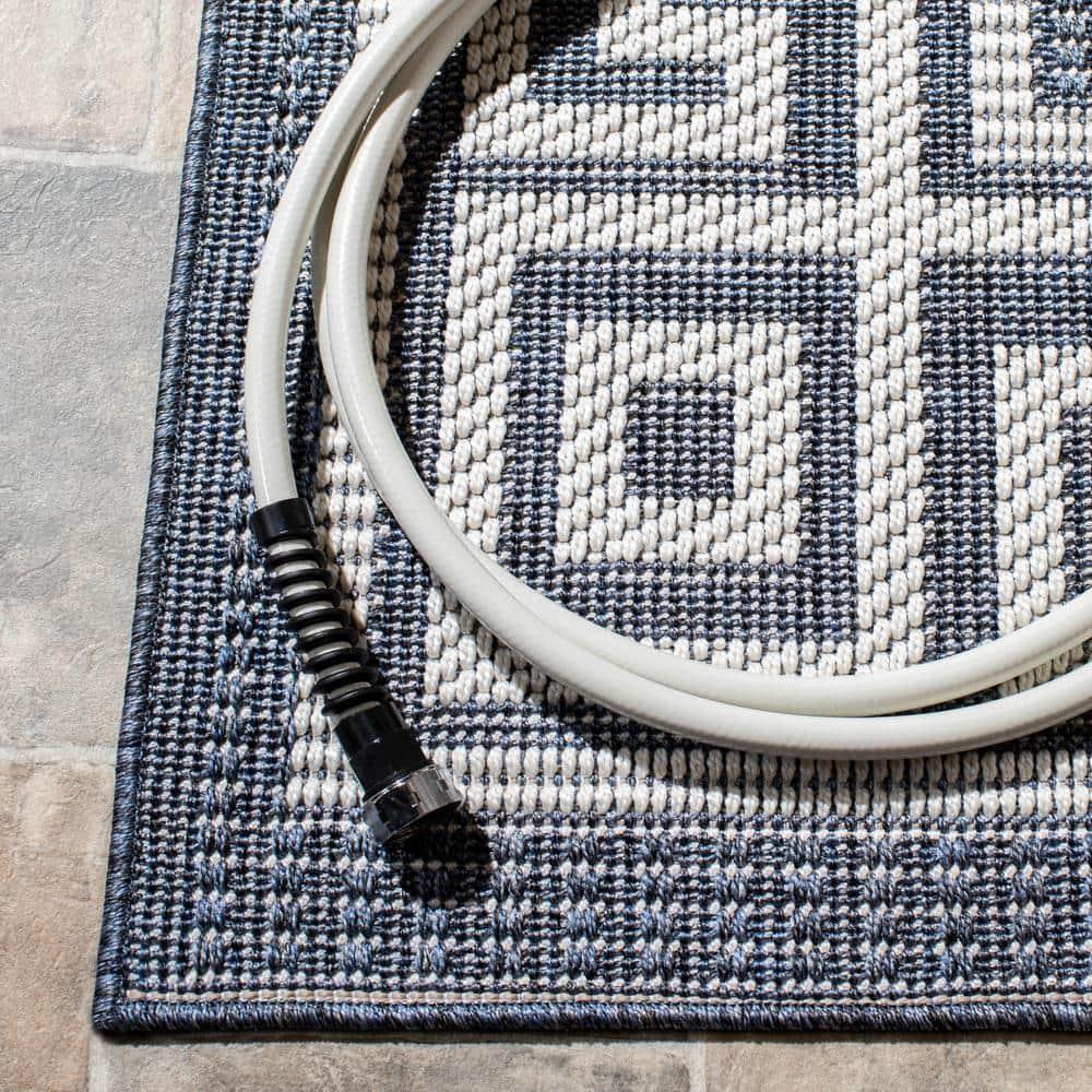 SAFAVIEH Bermuda Isidora Geometric Machine Washable Indoor/Outdoor Area Rug, Dark Blue/Ivory, 8' x 10'