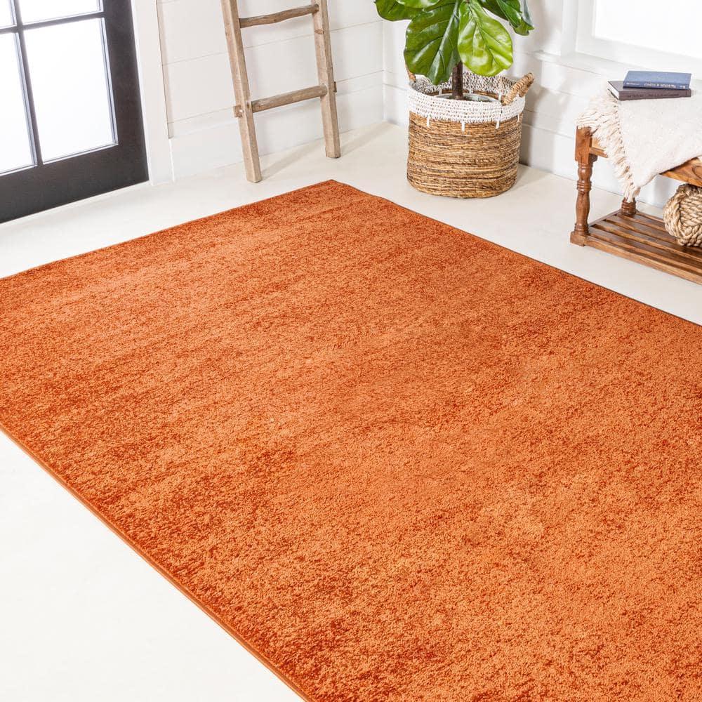 8'x10' Haze Solid Low-Pile Area Rug, Orange - JONATHAN Y