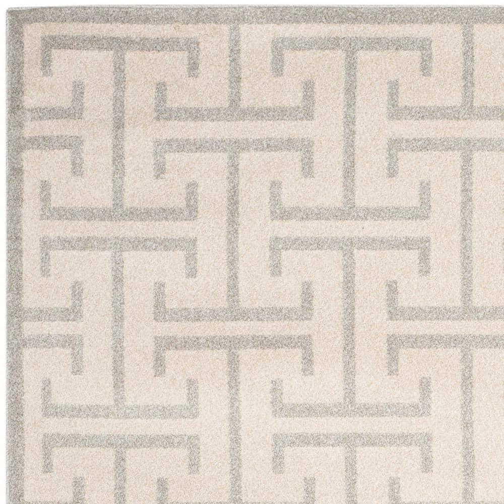 Ivory and Light Gray Rectangular 9' x 12' Synthetic Rug