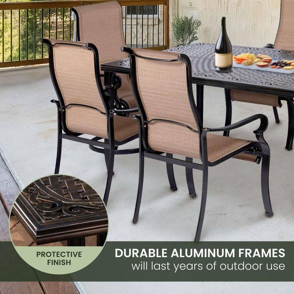 Hanover Brigantine Juego de Comedor Moderno para Exteriores de 7 Piezas / 4 Sillas con Cabestrillo, 2 Balancines Giratorios / Mesa con Tapa de 40'' x 70'' / Clima, Xido, Resistente a UV / Bronceado / BRIGDN7PCSW-2