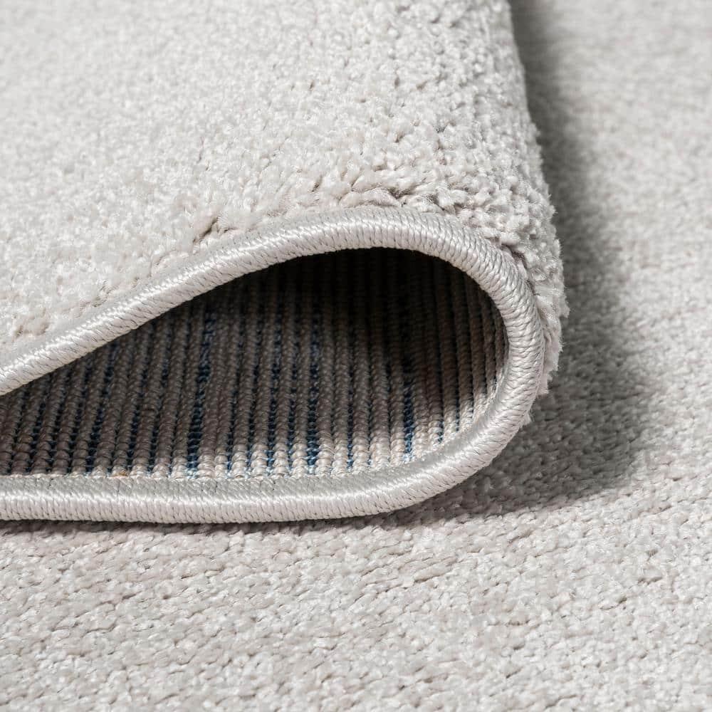 8'x10' Haze Solid Low-Pile Area Rug, Ivory - JONATHAN Y