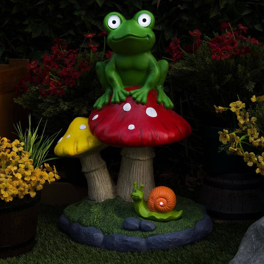 Solar Frog Sitting On Top of Mushroom Statue