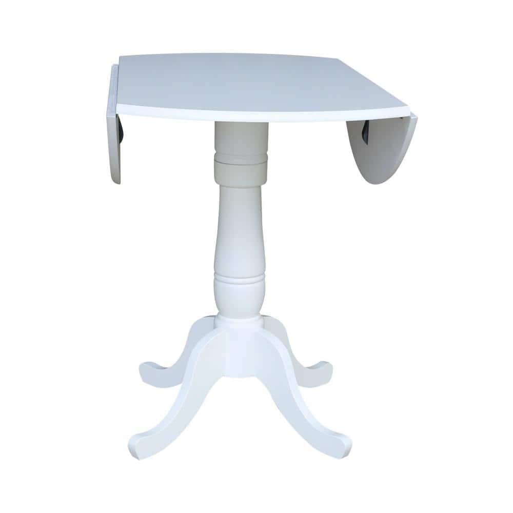International Concepts 42 In Round dual drop Leaf Pedestal Table - 35.5  inchesH