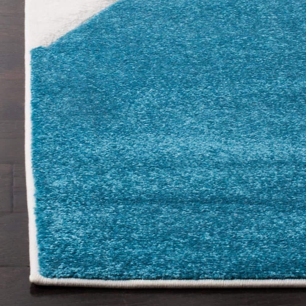 Hollywood HLW706 Power Loomed Area Rug - Peacock Blue/Fuchsia - 5'3"x7'6" - Safavieh.