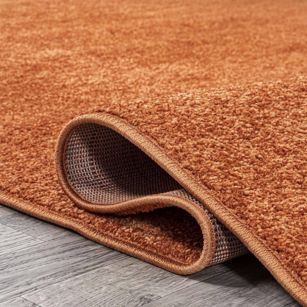 8'x10' Haze Solid Low-Pile Area Rug, Orange - JONATHAN Y